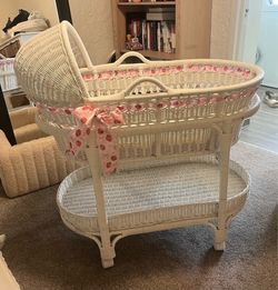 Pottery Barn White Whicker Bassinet retails for $500