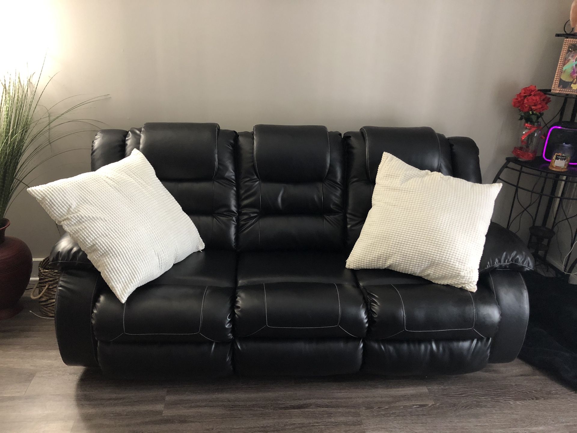 Black Leather dual Recliner 7 Feet across.