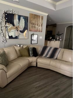 Cream leather sectional and black leather recliner