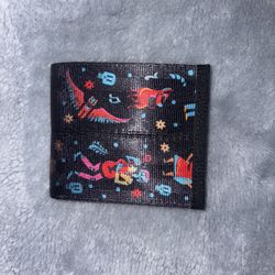 Harvey's Seatbelt Bags bifold wallet featuring artwork from Disney Pixar Coco