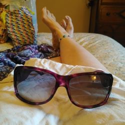 Dior Purple Sunglasses Front Is Tortoise Shell Purple And The Sides Are Straight Purple You Can See The Dior Label In The Glass.