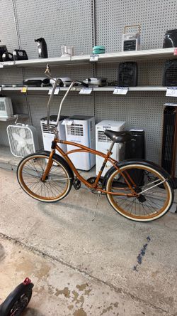Huffy cranbrook orange bike with long handle bars