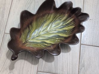 Home American Simplicity Stoneware leaf-shaped dish. It features a hand-painted brown and green glaze designed to resemble an oak leaf, complete with 