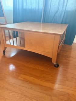 Wooden coffee table on wheels