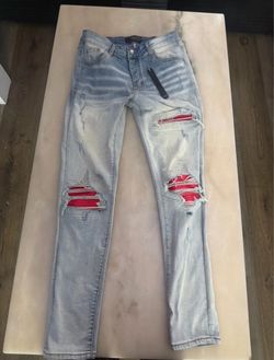 Amiri MX1 Light Wash Distressed Jeans