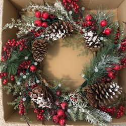 20” Christmas wreath. Pre-lit with battery operated white pearl lights.