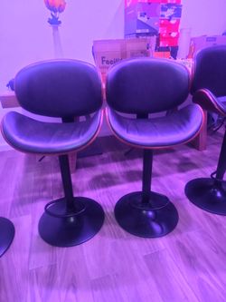 Adjustable leather and wood bar stools