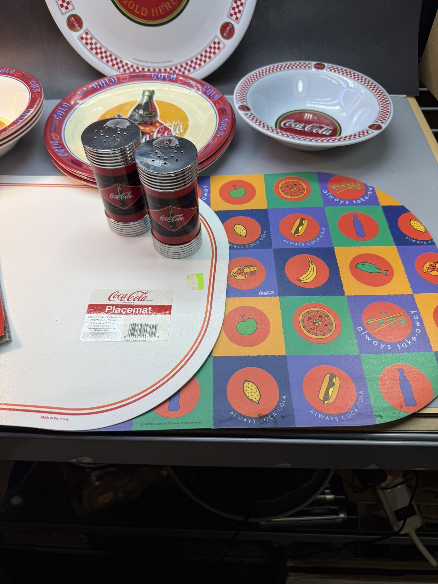 Free Shipping Coca Cola Lot of 4 plates. 4 bowls. 2 placemats. 1 cook book. Salt & pepper shakers.