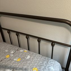 Iron twin frame and mattress .