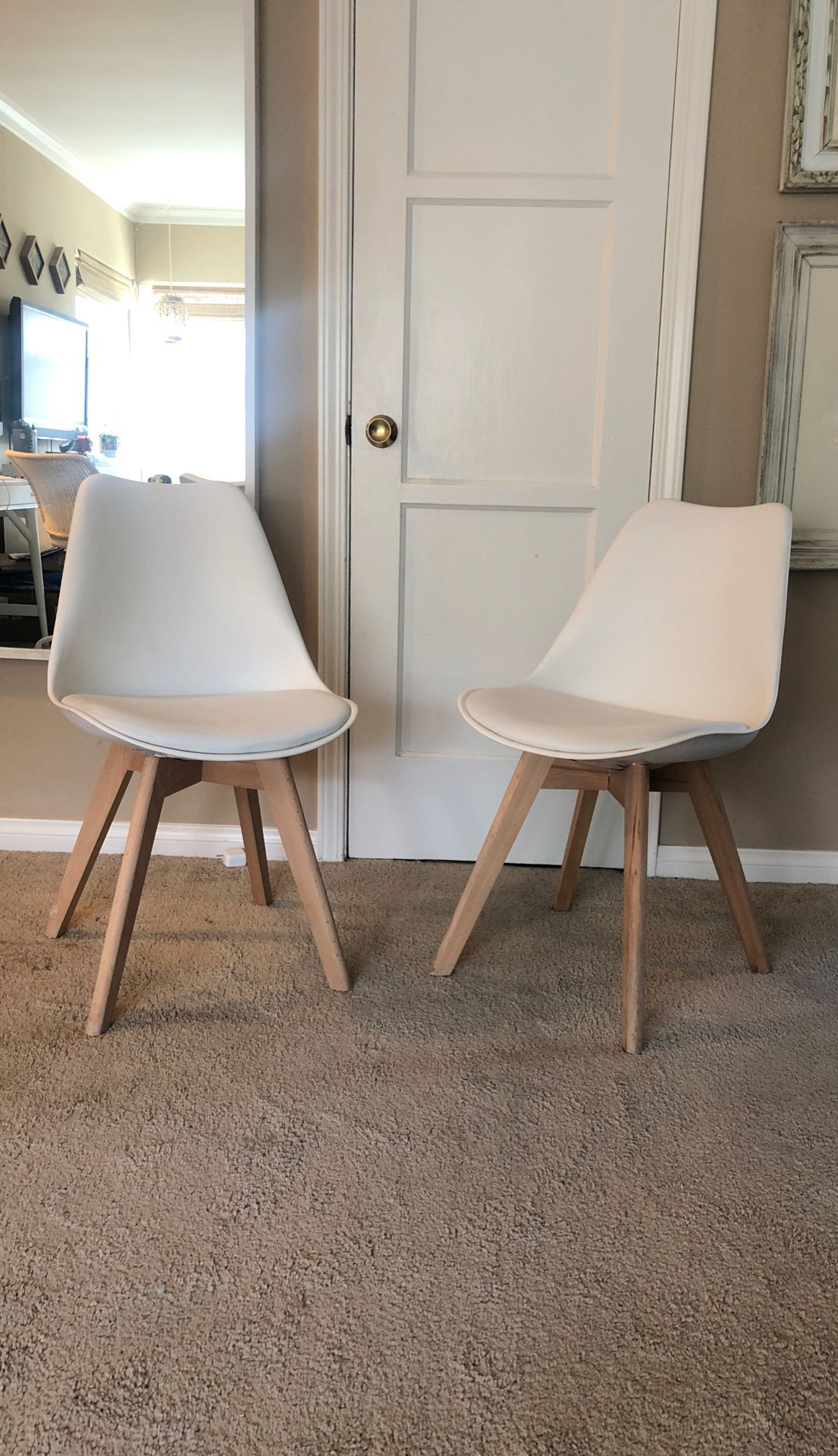 Pair of mid century modern dining chairs with white leather seat