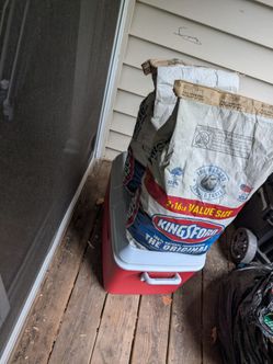 Selling two bags of charcoal and a cooler for 30 bucks