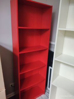 Red and white shelfs and Black cabinet