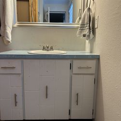 Toilet, vanity, shower