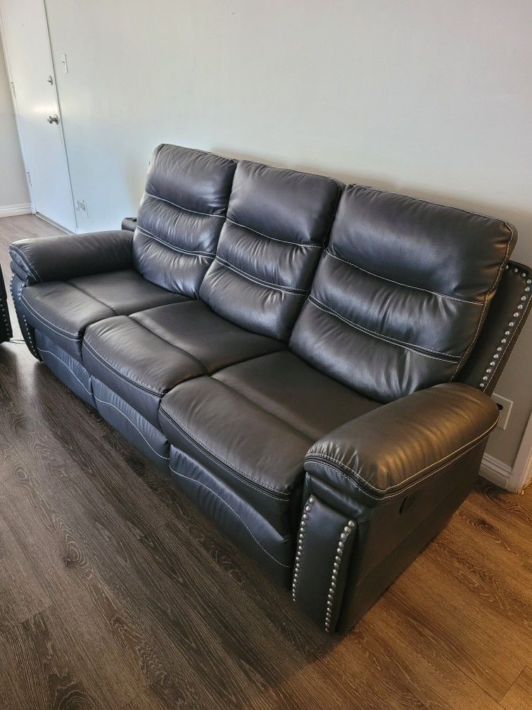 Two sets leather sofa- reclining in very good condition.