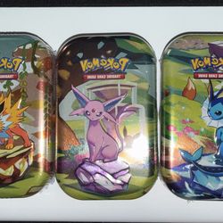 Prismatic Evolution Tins 
