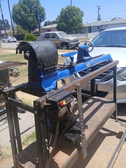 Vintage, cast-iron Dunlap wood lathe setup built onto a heavy-duty custom mobile frame