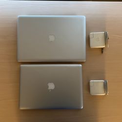 2 MacBooks w/AC adapters 