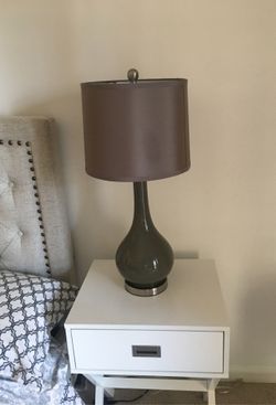 Bedside light. . Gray /olive color . Glass frame with silk shade .