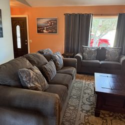 Ashley Charcoal Chenille Fabrics Sofa and Loveseat set with rolled arms and nailhead trim