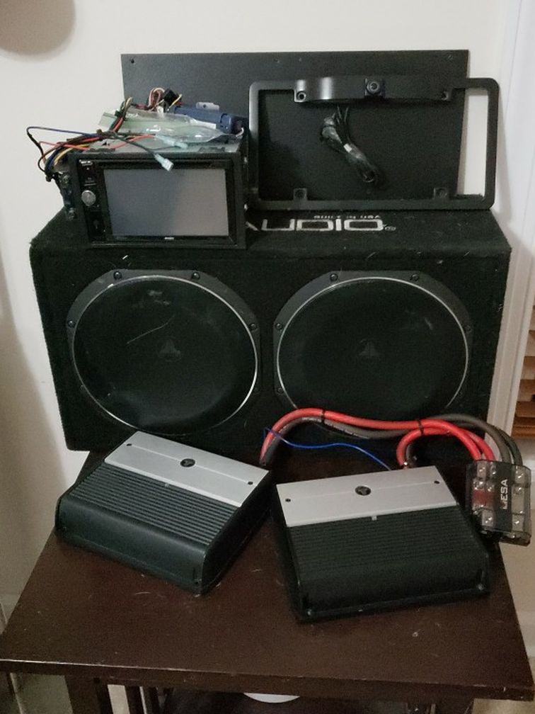 JL audio sub and amps with Jensen headset and camera for plate