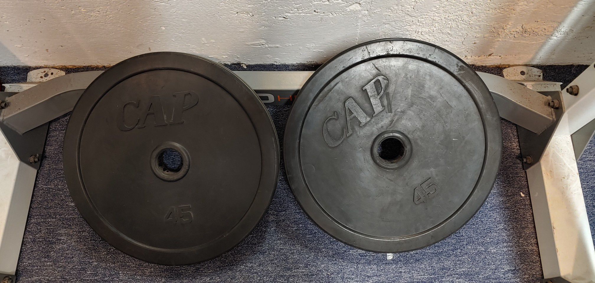 Two 45lb Olympic weight plate rubber encased bumper