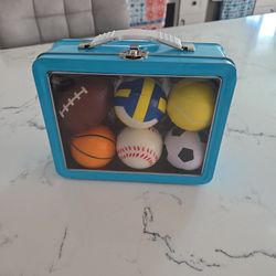TIN BOX AND 6 SOFT SPORT BALLS SEE DESCRIPTION 