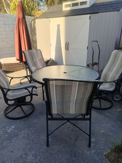 Patio table 4 chairs with umbrella solar panel