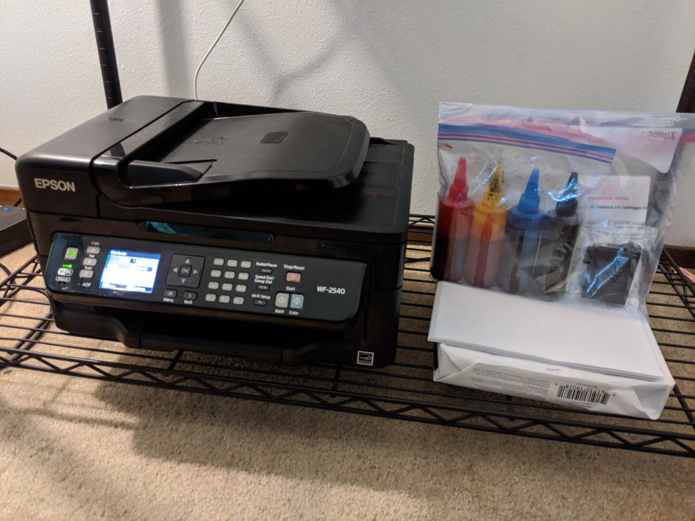 Epson WF-2540 with ink and paper