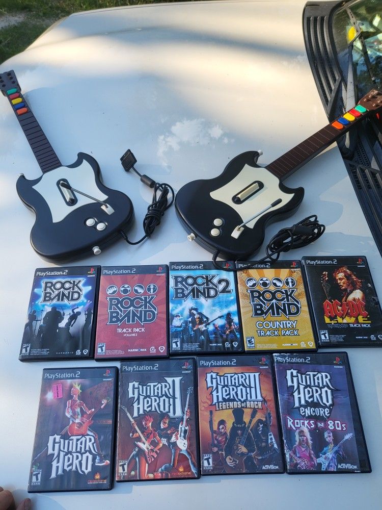 Huge guitar hero bundle 2 guitars 9 games and 2 packs of unopend original stickers