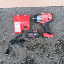 Milwaukee Fuel brushless 1/2 in impact drill with bigger battery and charger works great 