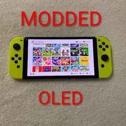 NINTENDO SWITCH OLED + 125 SWITCH GAMES and 7500 OLD SCHOOL RETRO GAMES INSTALLED