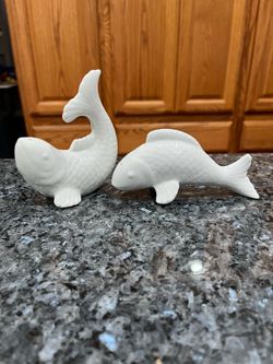Ceramic Large White Fish pair of salt and pepper shakers.  Preowned .  Had been on display in a cabinet with a very large salt and pepper shakers coll