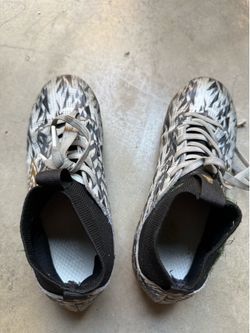 Boy’s soccer cleats and goalie gloves