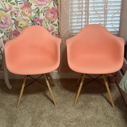 Two Pink Plastic Chairs