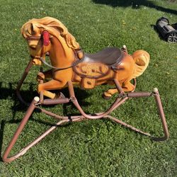 Cute baby’s rocking toy horse