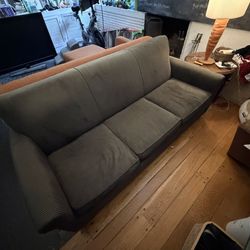 Three seater brown couch