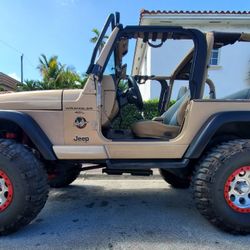 JEEP WRANGLER SAHARA BROWN  TIRES 37 NICE..CUSTOM TRADE..jeep 99 sahara 4.0 6 cyl automatic airbags cruiser control cool a/c 130.500 miles power air a