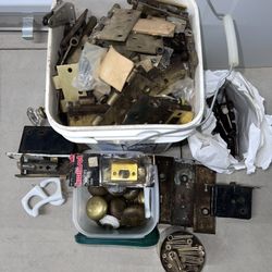 Various metal door hinges and parts.
