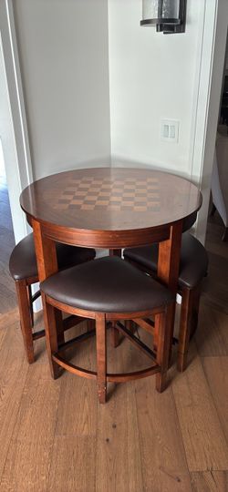 Circle high top game table with four chairs