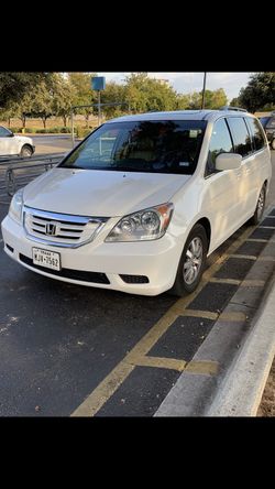 Minivan description: 2009 Honda Odyssey Touring. V6 engine, GPS Navigation, Rear View Camera, DVD player, 6 CD player Leather seats, auto front seat,