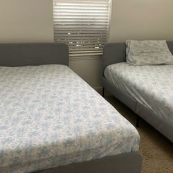 Ikea Full bed frames with mattress.