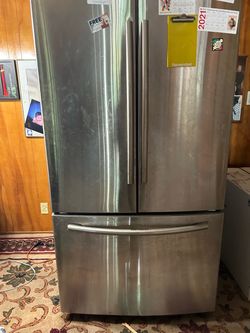 Samsung French-door refrigerator with bottom freezer.  * Brand: Samsung * Model: RF26HFENDSR/AA * Style: French door with bottom freezer * Color: Stai