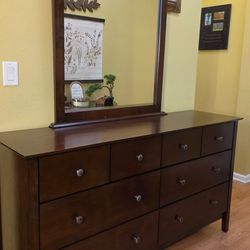 Clean and Nice Brown 8 Drawer Dresser and Mirror.