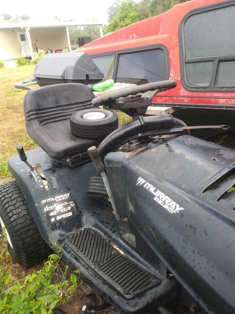 Riding lawn mower with an extra motor
