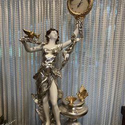 Woman With Clock Statue 