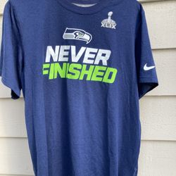 Seattle SeaHawks Nike Dri Fit NFL Super Bowl XLIX Never Finished Blue Sz S 20" Chest, 27.5" long. Worn once!