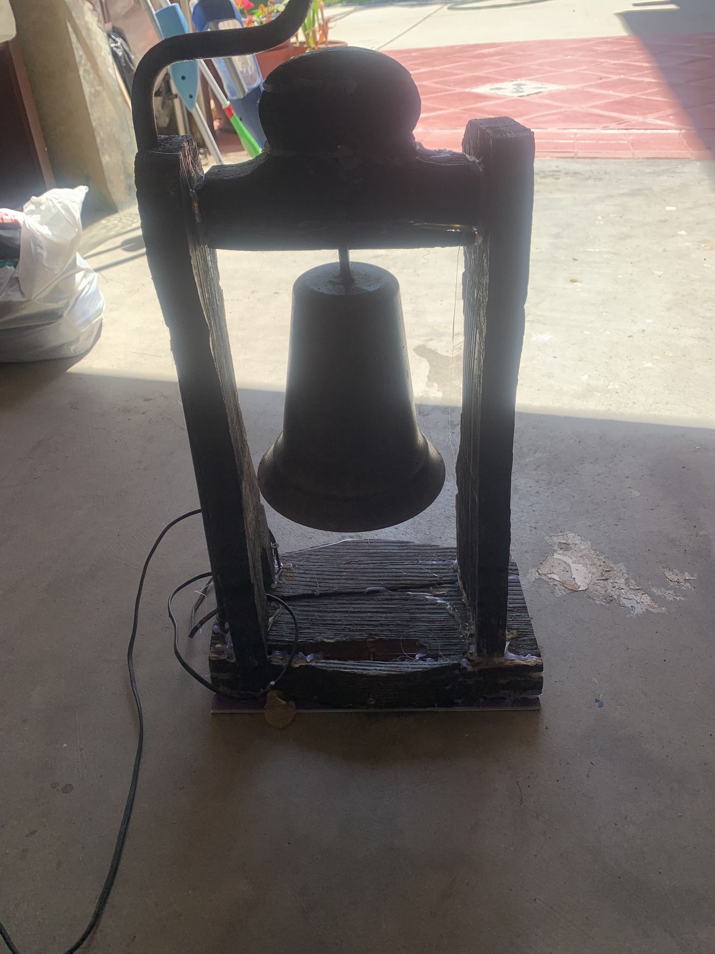 Wooden lamp with brass bell and shade