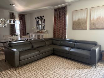 Gray Leather Sectional Sofa with Adjustable Headrests