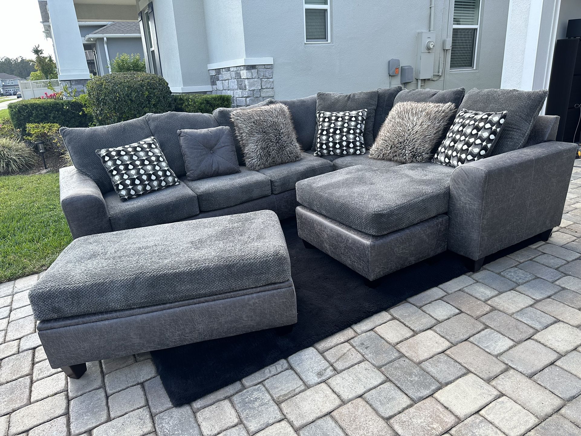 Gray 4 Piece Sectional and Black rug