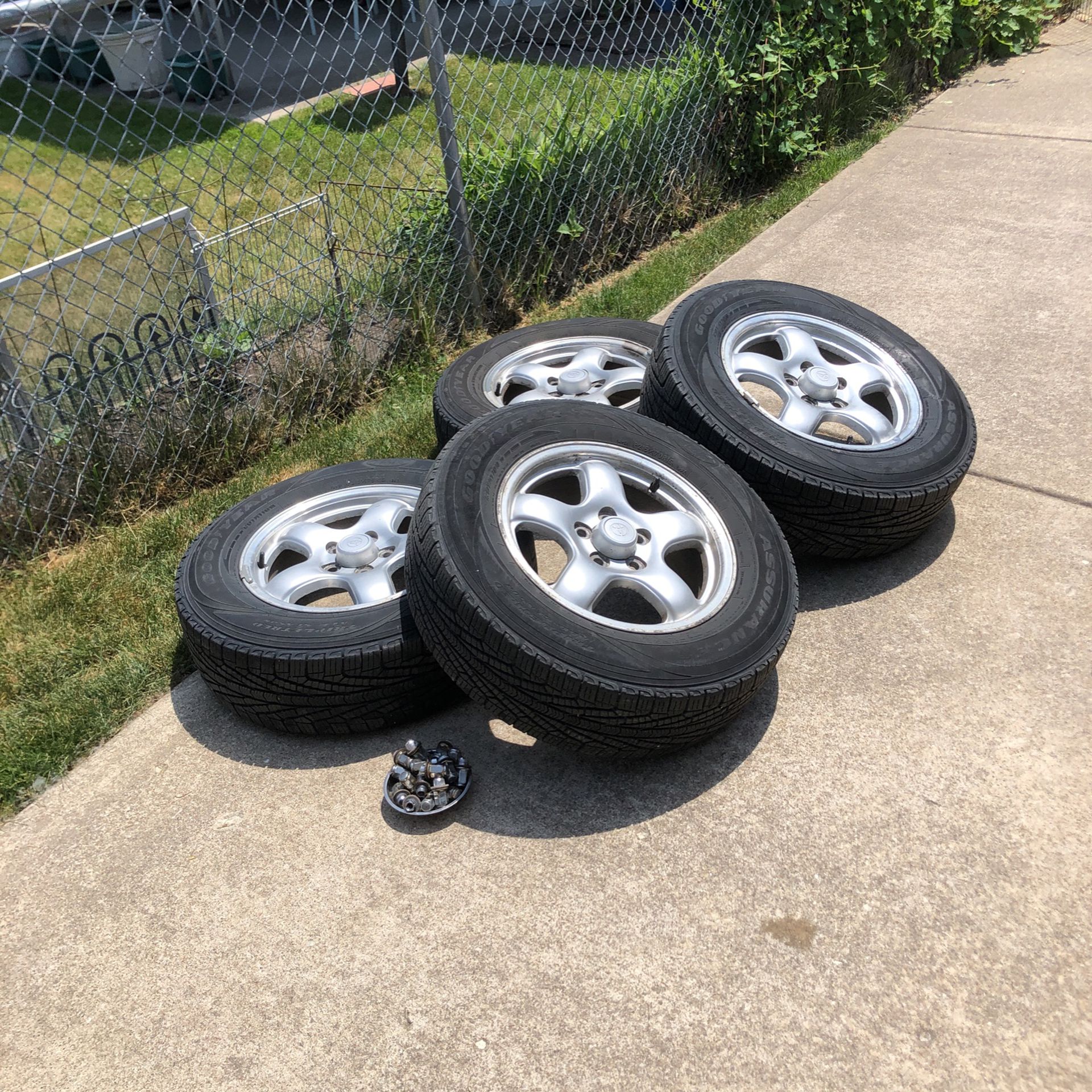 Set of four wheels/rims and tires off of a 1997 Toyota RAV4 four-wheel-drive